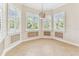 Charming breakfast nook with a decorative light fixture and bright windows at 16101 Cape Coral Dr, Wimauma, FL 33598