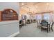 Well-lit game room offers tables and chairs perfect for card games and other activities at 16101 Cape Coral Dr, Wimauma, FL 33598