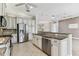 Kitchen with stainless steel appliances and plenty of cabinet space, perfect for cooking at 16101 Cape Coral Dr, Wimauma, FL 33598