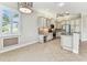 Bright and airy kitchen with stainless appliances, custom cabinetry and charming breakfast nook at 16101 Cape Coral Dr, Wimauma, FL 33598