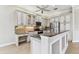 Modern kitchen with stainless steel appliances and granite countertops; ideal for culinary enthusiasts at 16101 Cape Coral Dr, Wimauma, FL 33598