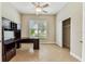 Office area with built-in desk and storage; good natural light from the large window at 16101 Cape Coral Dr, Wimauma, FL 33598