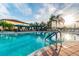 Resort-style pool offering plenty of lounge chairs and shady cabanas in a luxurious community at 16101 Cape Coral Dr, Wimauma, FL 33598