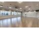The yoga studio has plenty of natural light and laminate wood flooring at 16101 Cape Coral Dr, Wimauma, FL 33598