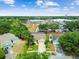 Aerial view of neighborhood with mature trees and neatly manicured lawns at 1758 Biarritz Cir, Tarpon Springs, FL 34689