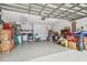 Spacious garage with epoxy flooring, washer, dryer, and plenty of storage space at 1758 Biarritz Cir, Tarpon Springs, FL 34689