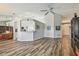Open-concept living room with modern decor, wood flooring, and an airy design, perfect for entertaining at 1758 Biarritz Cir, Tarpon Springs, FL 34689