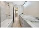 Elegant bathroom with a shower, a bathtub, and granite countertop vanity at 1890 Wateroak W Dr, Clearwater, FL 33764