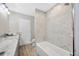 Bright bathroom featuring a shower, tub, and marble vanity at 1890 Wateroak W Dr, Clearwater, FL 33764