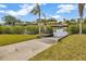 A private concrete boat ramp leads to the canal behind the home at 1890 Wateroak W Dr, Clearwater, FL 33764
