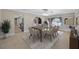 Dining room features an arched doorway, a dining table, and tile floors at 1890 Wateroak W Dr, Clearwater, FL 33764