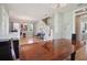 Dining room with wood floors connecting to an open living area and staircase at 2009 153Rd E Ct, Bradenton, FL 34212