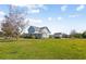 Beautiful two-story home with a large front yard, mature trees, and attached car port at 2009 153Rd E Ct, Bradenton, FL 34212