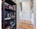 Bright hallway featuring a built-in bookshelf and access to the stairs at 2009 153Rd E Ct, Bradenton, FL 34212