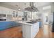 Spacious kitchen with blue and white cabinets, stainless steel appliances, and a large island at 2009 153Rd E Ct, Bradenton, FL 34212