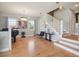 Bright living room with wood floors, a piano, and large windows offering natural light at 2009 153Rd E Ct, Bradenton, FL 34212