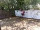 Fenced backyard featuring both a wooden fence, a vinyl fence, and privacy landscaping at 2025 Dover Ct, Oldsmar, FL 34677