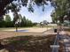 View of a basketball court in a park with multiple hoops and court markings at 2025 Dover Ct, Oldsmar, FL 34677