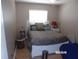 Bedroom with wood laminate flooring and natural light from the bright window at 2025 Dover Ct, Oldsmar, FL 34677
