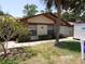 Charming single-story home with stone accents, mature landscaping, and a well-maintained lawn at 2025 Dover Ct, Oldsmar, FL 34677