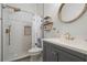 Bright bathroom featuring a tiled walk-in shower and a modern vanity at 2142 Scarlet Oaks St, Clearwater, FL 33759
