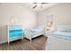 Bright bedroom with two beds and a colorful dresser at 2142 Scarlet Oaks St, Clearwater, FL 33759