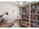 Bedroom with an organized desk area and a full wall bookshelf at 2142 Scarlet Oaks St, Clearwater, FL 33759