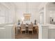 Bright dining room featuring decorative lighting, white walls, and views to the main living area at 2142 Scarlet Oaks St, Clearwater, FL 33759