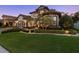 Beautiful home with well-maintained landscaping, a paved driveway, and accent lighting, exuding elegance at 2142 Scarlet Oaks St, Clearwater, FL 33759