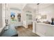 Grand foyer with double doors, decorative window, and views to the dining and living rooms at 2142 Scarlet Oaks St, Clearwater, FL 33759