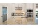 Close-up of kitchen featuring modern appliances, cabinetry, tile backsplash, and granite countertops at 2142 Scarlet Oaks St, Clearwater, FL 33759