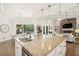 Gourmet kitchen with a large center island, modern appliances, and open layout to the rest of the home at 2142 Scarlet Oaks St, Clearwater, FL 33759