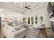 Spacious living room with coffered ceilings seamlessly connects the kitchen and outdoor spaces at 2142 Scarlet Oaks St, Clearwater, FL 33759