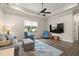 Comfortable living room featuring hardwood floors and a large window at 2142 Scarlet Oaks St, Clearwater, FL 33759