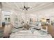 Expansive living room with coffered ceilings leading to the kitchen and grand double-door entry at 2142 Scarlet Oaks St, Clearwater, FL 33759