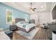 Serene main bedroom with tray ceilings, natural light, and hardwood flooring at 2142 Scarlet Oaks St, Clearwater, FL 33759