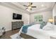 Spacious main bedroom with a large window, decorative ceiling and a modern dresser at 2142 Scarlet Oaks St, Clearwater, FL 33759