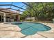A beautiful pool with spa, and ample seating areas at 2142 Scarlet Oaks St, Clearwater, FL 33759