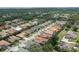 Aerial street view displays homes with mature trees and well-maintained landscaping at 2142 Scarlet Oaks St, Clearwater, FL 33759