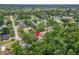 An overhead view displays the property within a lush, tree-filled community at 23739 Forest View Dr, Land O Lakes, FL 34639