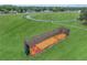 Outdoor baseball cage with turf, metal fencing, and green surroundings at 23739 Forest View Dr, Land O Lakes, FL 34639