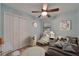 Charming bedroom with a daybed, ceiling fan and closet space at 23739 Forest View Dr, Land O Lakes, FL 34639