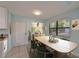 Cozy dining room featuring a modern table, stylish chairs, and a bright window at 23739 Forest View Dr, Land O Lakes, FL 34639