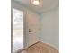 Bright entryway with tile flooring, a modern door, and ample natural light at 23739 Forest View Dr, Land O Lakes, FL 34639