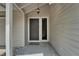 Welcoming front door with sidelight, exterior lantern, and neutral siding at 23739 Forest View Dr, Land O Lakes, FL 34639