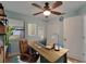 Well-lit home office with a desk, chair, and shelving, perfect for remote work at 23739 Forest View Dr, Land O Lakes, FL 34639