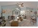 Stylish living room featuring high ceilings, comfortable seating, and modern decor at 23739 Forest View Dr, Land O Lakes, FL 34639