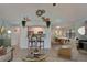 Open-concept living area with bar seating, a dining table, and a comfortable living space at 23739 Forest View Dr, Land O Lakes, FL 34639