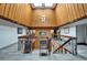 A well-maintained lobby entrance, accented by wooden walls, lighting, and an airy skylight, offers a welcoming atmosphere at 23739 Forest View Dr, Land O Lakes, FL 34639