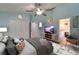 Bright bedroom featuring vaulted ceilings, ceiling fan, closet, and access to en-suite bathroom at 23739 Forest View Dr, Land O Lakes, FL 34639